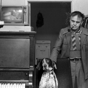 man, dog, piano, television,